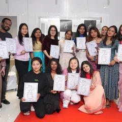 A group of proud graduates holding their certificates at our HRBR Layout launch event. This is what success looks like, and we celebrate every student's achievement.