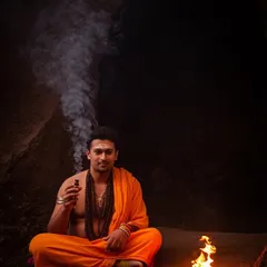 In a cave, with only a small flame for light, the practice turns inward. This is a representation of finding light in the darkness.