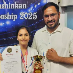 Celebrating the success of our karate champion. Holding her trophy and certificate from the Sanshinkan Championship, she represents the dedication and spirit we nurture in all our young students.