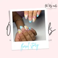 A sweet and delicate floral story. This design features a sheer base with hand-painted daisies in yellow, white, and purple, complemented by baby blue French tips and a tiny bow accent.