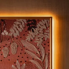 This isn't just wallpaper; it is artwork in thread. This heavily handcrafted embroidered wallpaper took master artisans weeks to create, with every inch detailed with floral motifs, beaded accents, and delicate stitching. It brings texture, warmth, and quiet drama to the space.