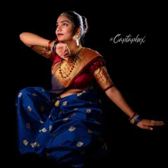 A dynamic pose capturing the grace and movement associated with traditional Indian attire. This shot is perfect for demonstrating how the fabric flows and how the model carries the look with elegance.