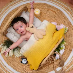 Reaching out to the world! This action shot captures the natural movements and stretches of a newborn.