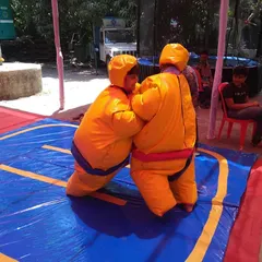 The sumo suit wrestling game is guaranteed to get laughs. I provide the padded suits and mat for a safe and hilarious competition that's just as fun for spectators as it is for the participants.