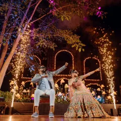 A high-impact couple's performance at their Sangeet. I coordinate with choreographers and technical teams to create show-stopping moments like this, complete with cold pyro effects.