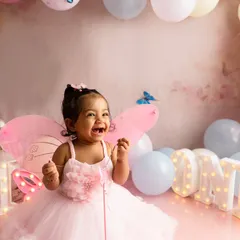 Capturing the pure, uninhibited joy of a first birthday cake smash. This butterfly themed session was designed to be fun and memorable, resulting in genuine laughter and beautiful photographs that celebrate this special milestone.