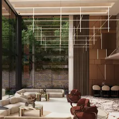 The interior of the Forest House, where a double-height living room is flooded with natural light. The design philosophy is biophilic, connecting the inhabitants with nature through views, materials, and the integration of indoor plants.