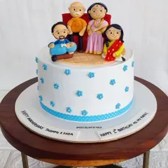 This cake is a tribute to a picture-perfect family moment. I recreated a family portrait with detailed fondant figurines, including grandparents, parents, and a new baby, to celebrate two occasions at once.