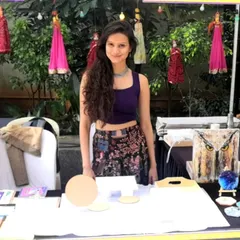 Here I am at my stall during 'The Village' flea market at JW Marriott. I love meeting new people and sharing my passion for art in person.