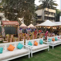 This image highlights the welcoming entrance to the Mehendi celebration. We used floral archways and traditional decor elements to create an inviting "shaadi ghar" feel, even in a large outdoor lawn setting.