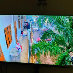 A clear, wide-angle view from a residential camera installation. You can see the entire street and entrance, providing excellent security and peace of mind for the homeowner.