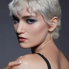 A stunning shot from our Bangalore batch's first portfolio shoot. This edgy look with a smokey eye and platinum pixie cut showcases the high-fashion aesthetic we teach.