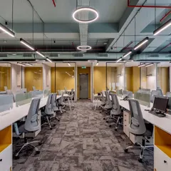 This view of the open-plan workspace shows our focus on creating a bright and orderly environment. The layout provides individual focus areas with low partitions while maintaining a sense of a larger, connected team.