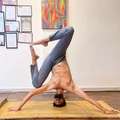 Exploring a variation of Mukta Hasta Sirsasana, or the tripod headstand. This posture challenges balance and opens the hips, requiring a great deal of concentration and stability through the shoulders and core.