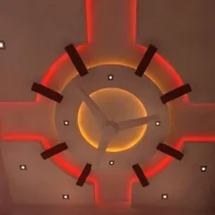 This circular design uses dual-color lighting for a striking effect. The inner circle has a warm yellow glow, while the outer ring is lit with a vibrant red, creating a fiery, sun-like appearance.