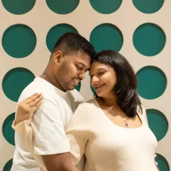Finding fun spots in your own home for photos! The unique patterned wall in their house made for a cool and modern backdrop for this sweet, close-up couple's portrait.