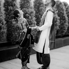 A burst of shared laughter between Karan and Shruti. Black and white photography is perfect for freezing these energetic, joyful moments in time.
