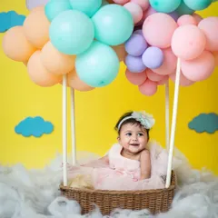 Announcing a very special milestone! This half-birthday hot air balloon shoot is a burst of pastel color and pure joy, perfect for celebrating your baby's first six months.