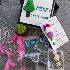 A custom Secret Santa hamper I put together, filled with a variety of my crochet goodies. I can create custom gift boxes for any occasion.