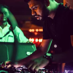 A candid moment of intense focus. Every set is a journey, and I put all my concentration into selecting the right tracks to guide the night's vibe.
