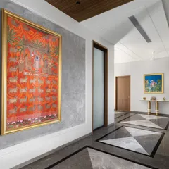 A vibrant Pichwai painting brings life and cultural richness to this corridor. We often use hallways as galleries to showcase art, transforming them from simple passages into destinations in their own right.