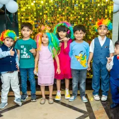 A group of partygoers showing off their colorful wigs and crowns. These props are perfect for breaking the ice and getting everyone in a playful mood.