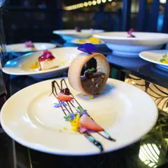 A dessert created for a star-studded evening at IIFA 2025. This dish features a delicate pastry ring filled with a rich mousse, garnished with fresh berries and edible flowers, showcasing our expertise in high-end event catering.