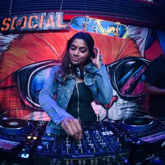 In the zone at The Grind, with the iconic graffiti wall and neon sign behind me. This is where the magic happens every weekend.