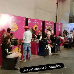 Our caricature stall at the Korean Festival in Mumbai. We were set up alongside tattoo and makeup stalls, creating a fun, interactive art corner for festival-goers.