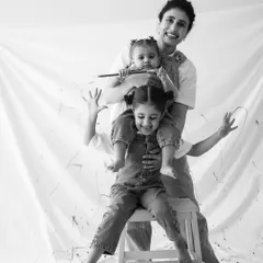 Making messes and memories. This playful 'Mom & Me' paint session is all about capturing laughter and fun. The black and white finish adds a timeless quality to the joyful chaos.