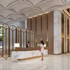 The reception desk in our South Mumbai project, crafted from a single piece of marble. The space is defined by a vaulted ceiling, brass accents, and a mix of modern and classic design elements, marrying exquisite detail with functionality.