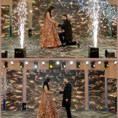 Your Sangeet is a full-blown production, and I capture it that way. This shot of Vivek proposing to Neha on stage, complete with pyrotechnics, shows how I document the grand, show-stopping moments of your celebration.