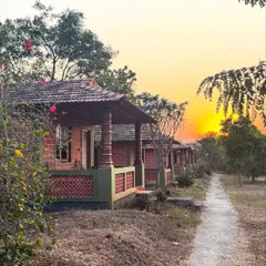 The sunset paints the sky with warmth as evening settles over the ashram. These quiet moments of reflection by the river or among the trees are a cherished part of the daily rhythm here.