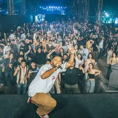 Hyping up the massive crowd at the Homegrown Festival. My job is to connect with every person, from the front row to the back.