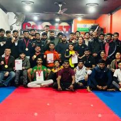 The whole Combat MMA Club family celebrating our success at the 12th Inter-Club Championship. Medals, certificates, and shared smiles all around.