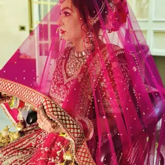 A timeless portrait of one of my brides. I focused on creating a classic red bridal look with defined eyes and a radiant base, complemented by a beautiful hair bun and traditional jewellery.