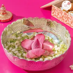 This elegant silver-plated bowl features a beautiful lotus petal design. Here, I've filled it with fresh jasmine and a lotus flower, but it can be gifted with sweets or dry fruits as a versatile and timeless keepsake.