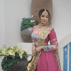 Another shot from the Navratri series. The makeup features a soft, glowing base and defined eyes, designed to look stunning in professional photographs.