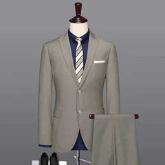A grey two-piece suit paired with a navy blue shirt. This shows how you can style our classic suits for a modern, smart-casual look.