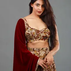 The beautiful Sapthami Gowda in a custom lehenga I created from a handloom saree. The earthy Kalamkari print is paired with a rich maroon velvet dupatta for a look that is both rustic and regal.