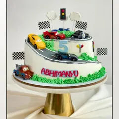 Who says you need fondant for a fun theme? This 3kg car-themed cake is covered in my signature, silky buttercream. Inside, it's packed with rich chocolate layers and my special in-house orange marmalade.