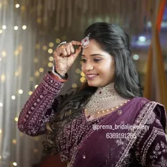 Another beautiful shot of the bride adjusting her maang tikka.