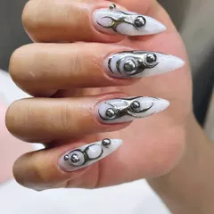 This is for the bold. We love pushing boundaries with avant-garde designs like this metallic and 3D sculpted set. If you want nails that are a true fashion statement, you've come to the right place.