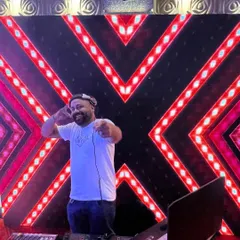 Getting the crowd hyped at a Goan wedding reception. I love playing a mix of Konkani classics and popular dance music to make sure everyone, from the youngsters to the uncles and aunties, has a great time.