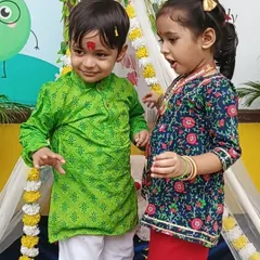 Dressed in their festive best, these children share a happy moment during our Rakshabandhan celebration.
