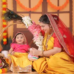 A heartwarming moment between a mother and her daughter during their Radha-themed photoshoot.