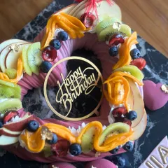 Indulge in elegance with our classy lavender cake, adorned with exotic fruits. This heart-shaped entremet cake is perfect as a centerpiece for a sophisticated dessert spread.