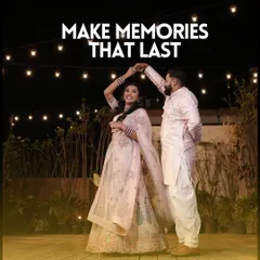 Make memories that last. A happy couple shares a dance under the stars and string lights on our rooftop terrace.