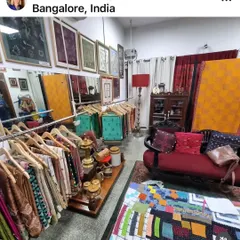 A wide view of the Sameeksha Studio, as captured by Textile Travels. It is a treasure trove of hand-embroidered sarees, antique furniture, and creative inspiration.
