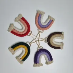 A circle of handmade rainbow keychains, each one a little burst of color and joy. These are one of the most popular items students learn to make and sell. They are perfect for birthday return gifts, bag charms, or simply to brighten up your keys.